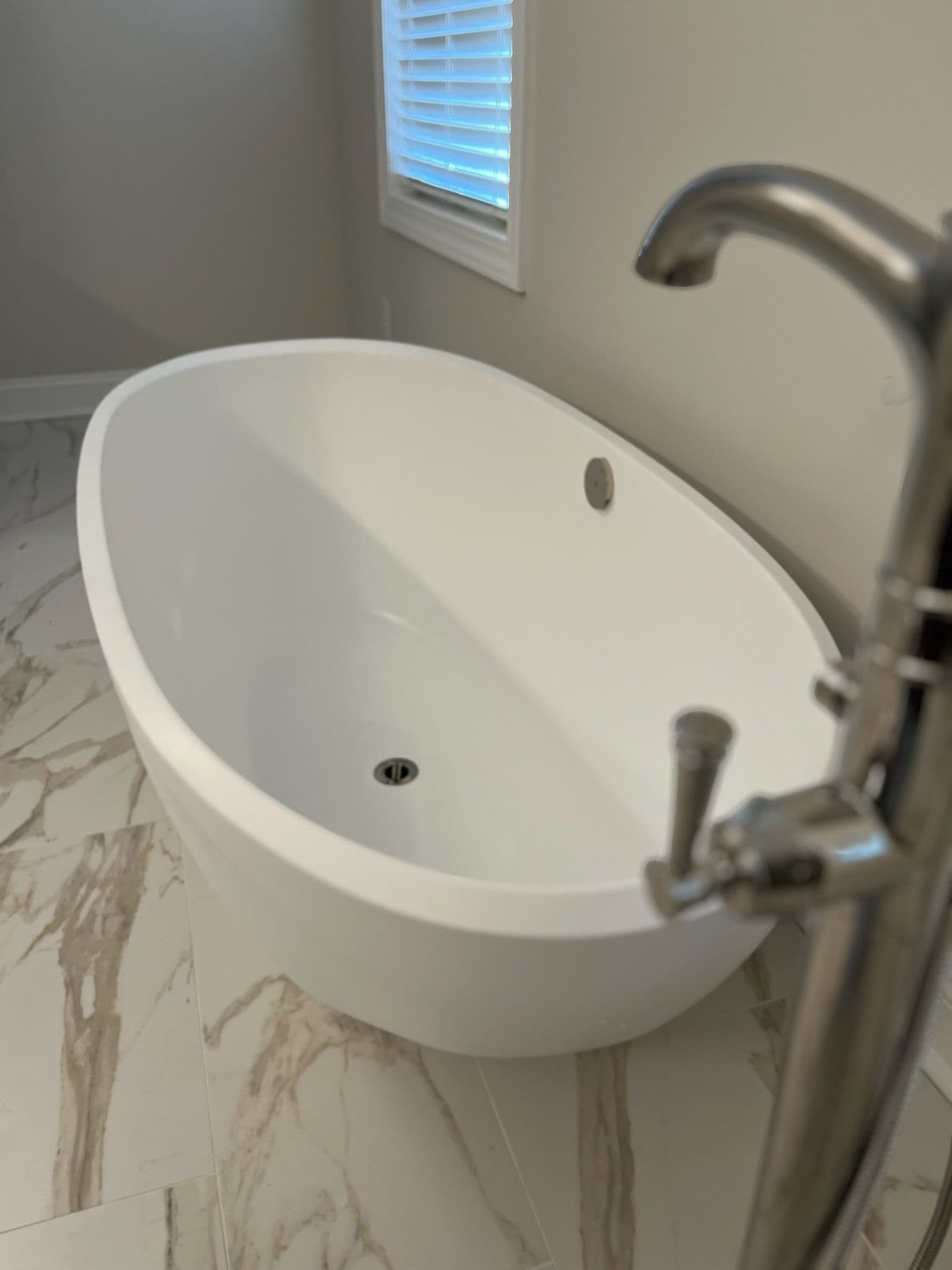 Freestanding Tub and Faucet Installation Brings Modern Elegance